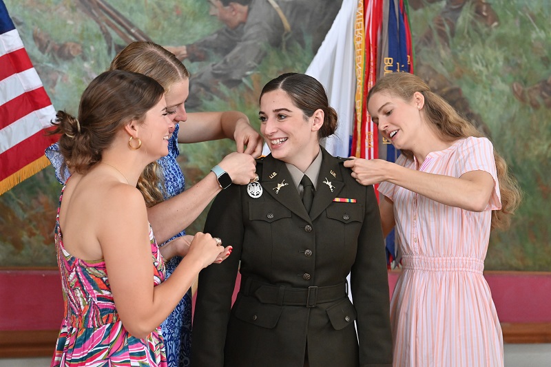 A college student participates in an Army ROTC commissioning ceremony at Virginia Military Institute.