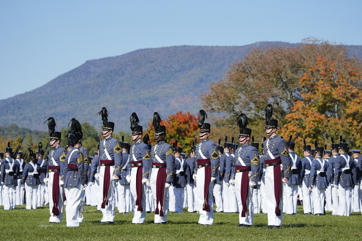 College students, who are members of the Corps of Cadets at VMI, march during a formal military parade.