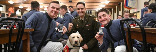 Juniors at VMI, referred to as 2nd Class cadets, pose with the Chaplain and CAVU, during Ring Figure events.