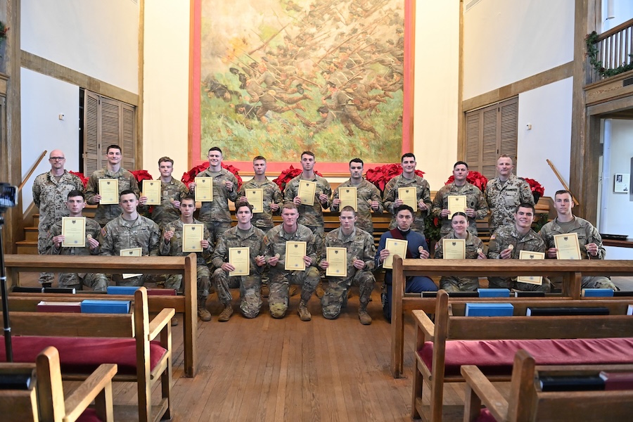Cadet pose with their badges and certificates in Memorial Hall.