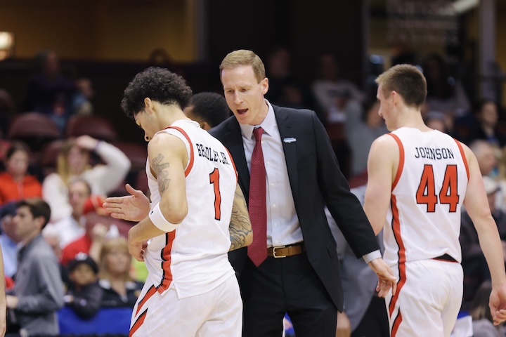 VMI coach speaks to cadets on the court.