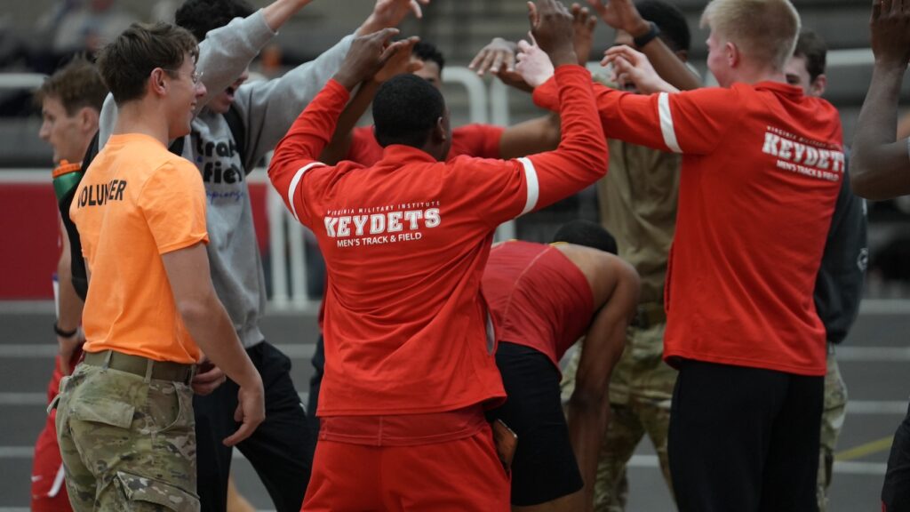 Track athletes gather in celebration.