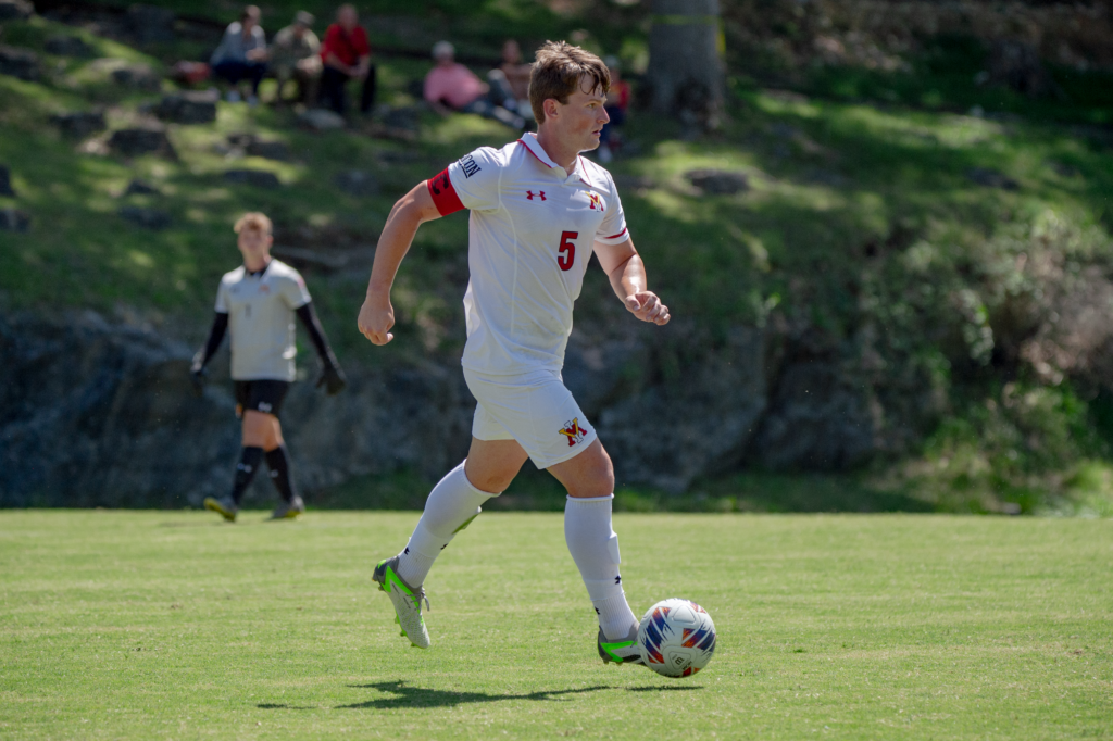 Colin Blandford kicks the soccer ball on the field during a Virginia Military Institute men' soccer game.