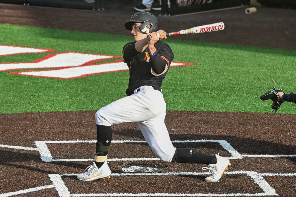 Ty Swaim swings a baseball bat during a Virginia Military Institute baseball game.