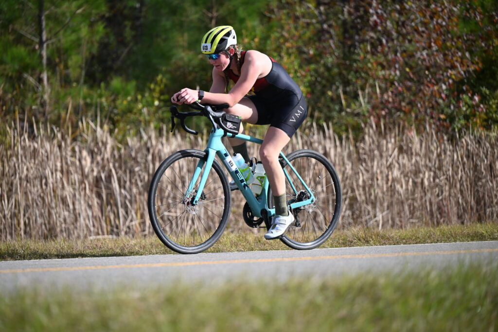 Cadet Sara Mihalovich rides a bike.