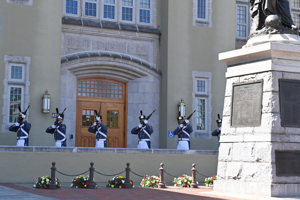 Cadets fire a 7-gun salute during the Memorial Parade as wreaths mark the graves of the New Market Cadets.