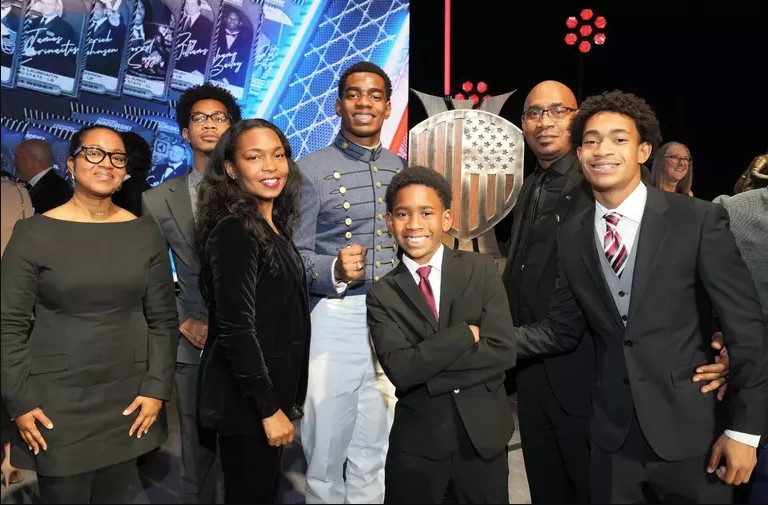 Crump shows off his VMI ring and smiles with family members.