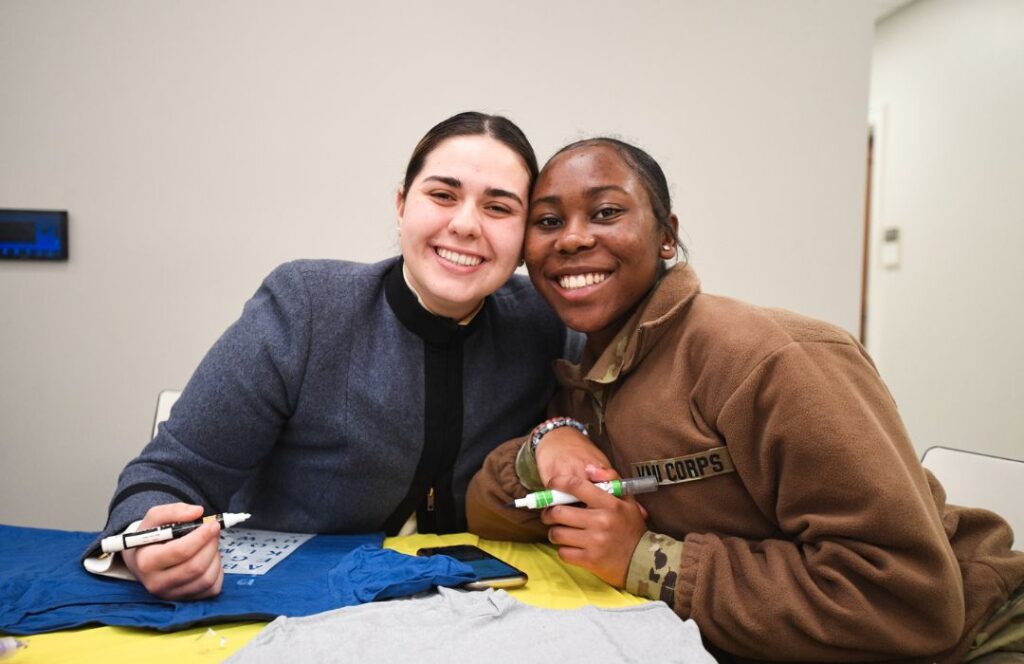 Two cadets pose for a picture.