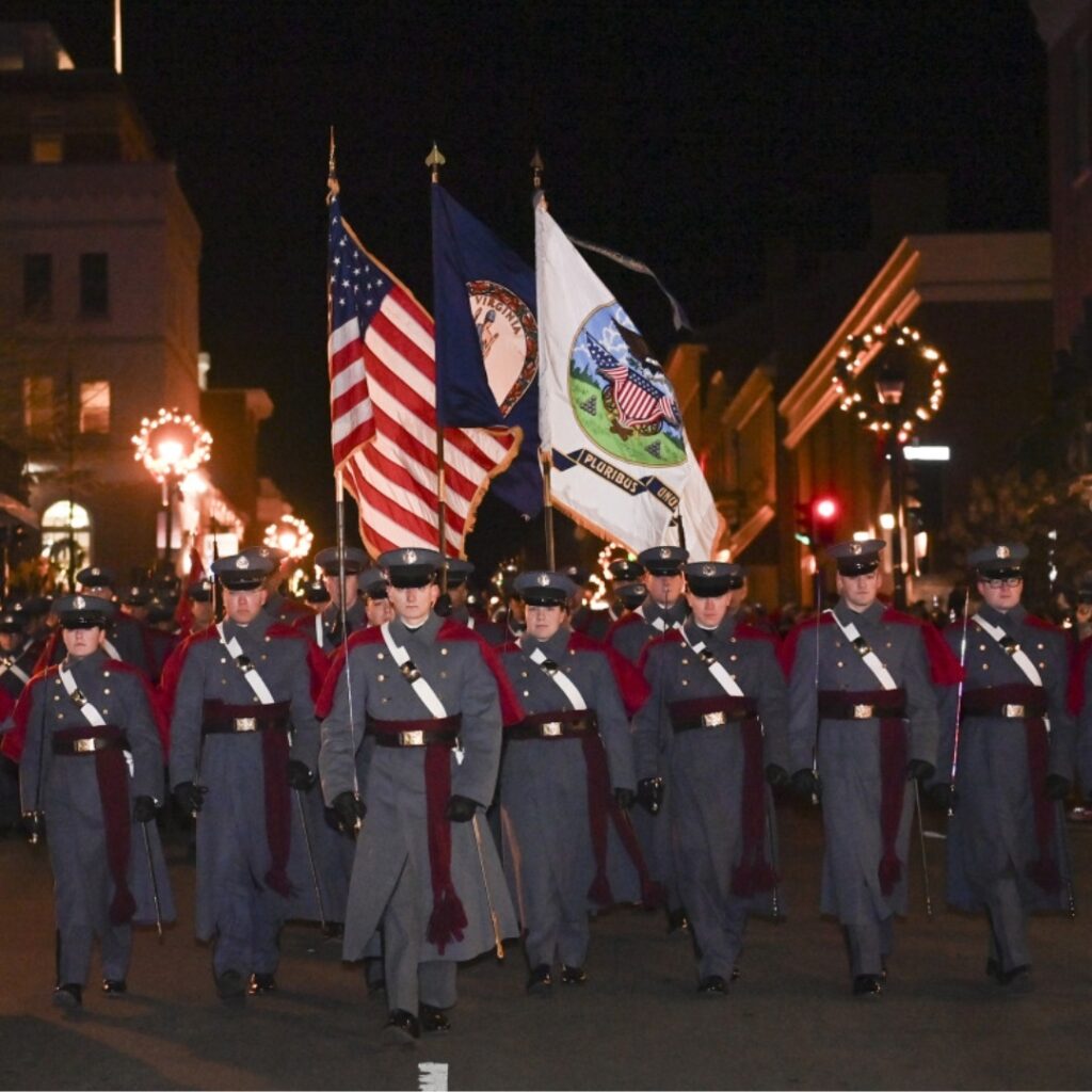 Members of the Corps of Cadets march down Main Street.