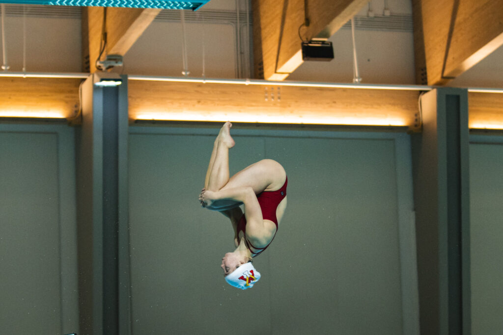 Isabelle Haer dives into the pool at Virginia Military Institute.