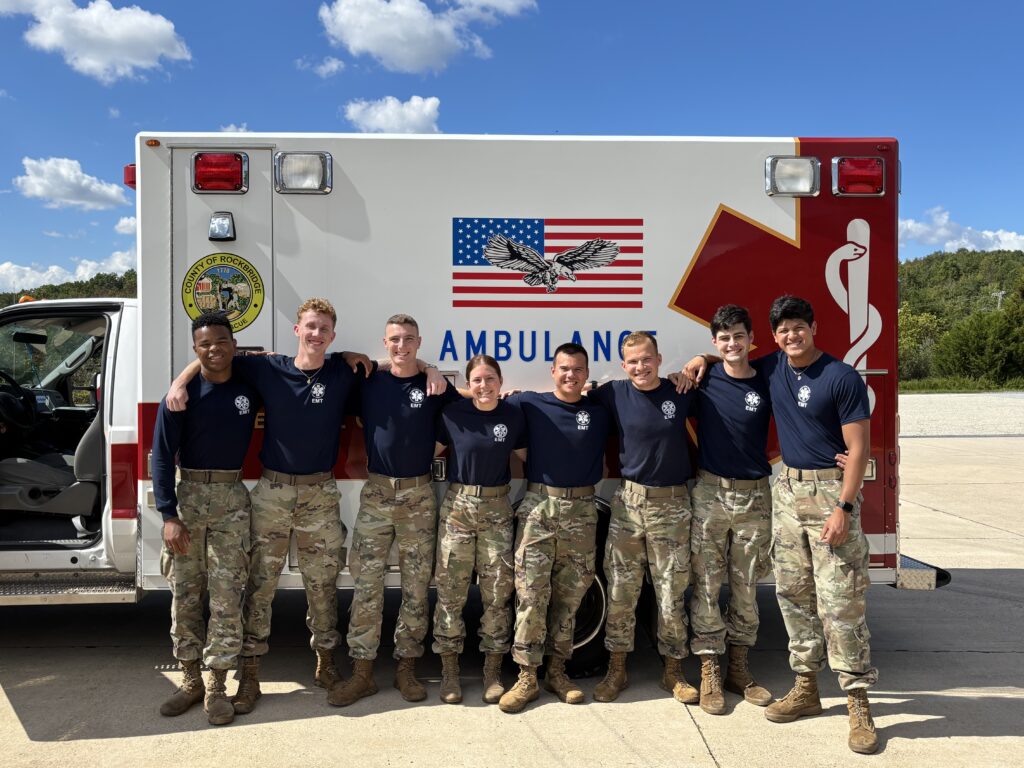 Cadet EMTs at Virginia Military Institute in front of an ambulance.