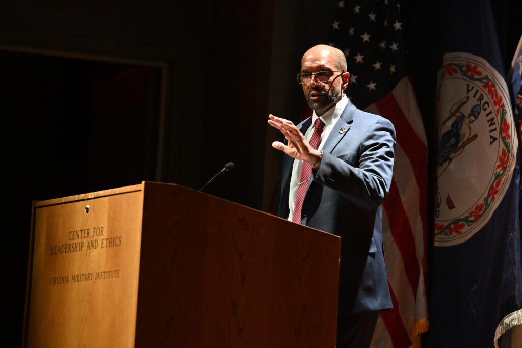 Gen. Gary Brito speaks at the podium in Gillis.