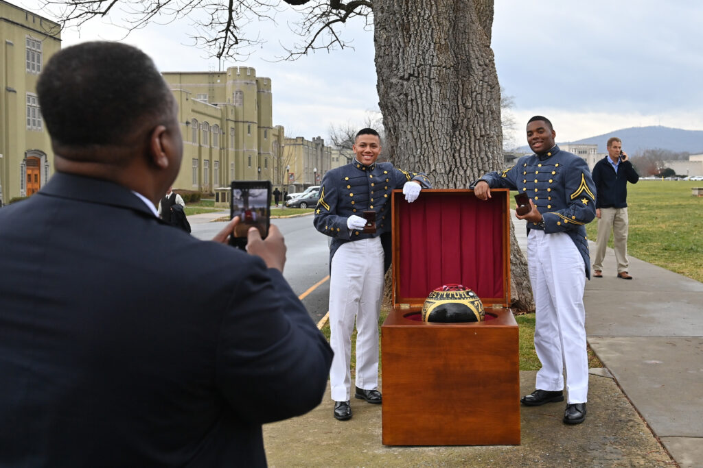 Cadets pose for a photo with their rings.