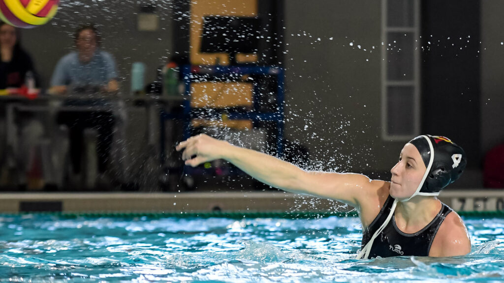 Courtney Novotny in the pool taking a shot for Virginia Military Institute's women's water polo team.