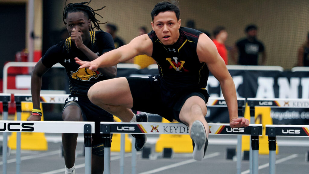 Zach Denton jumping hurdles during a track and field meet at Virginia Military Institute. 