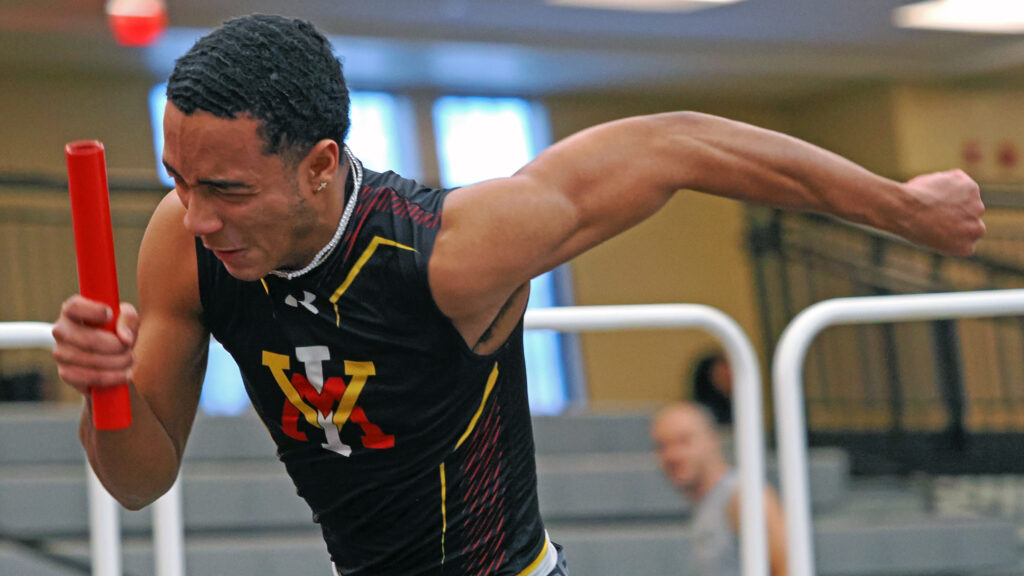 Cadet Anthony Wilkerson running an indoor track race.