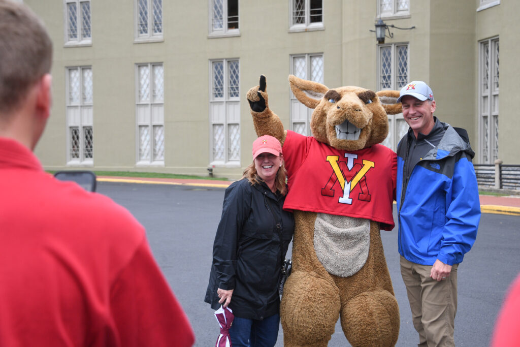 Moe poses with parents.