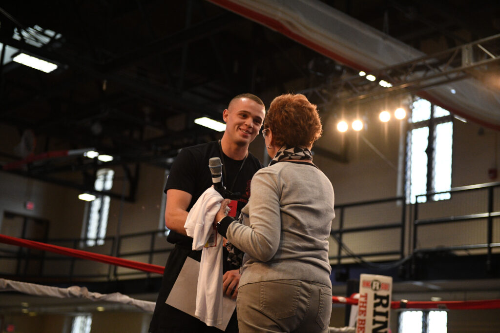 VMI boxer accepts award in the ring.