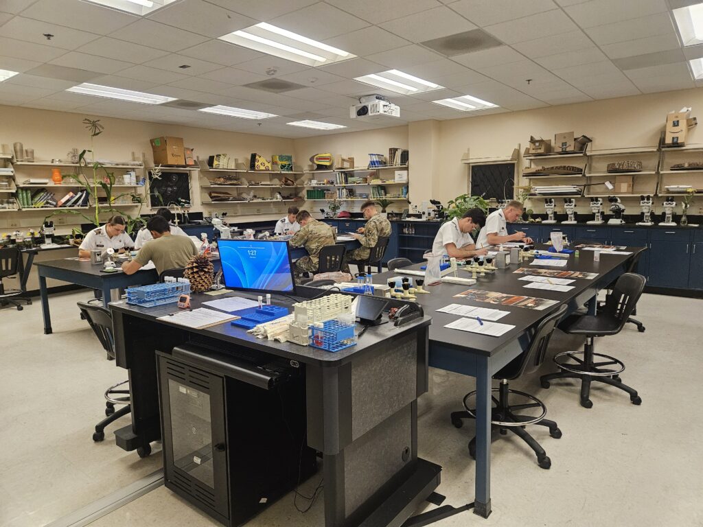 Eight cadets work independently to complete the safety hazard assessment certification.