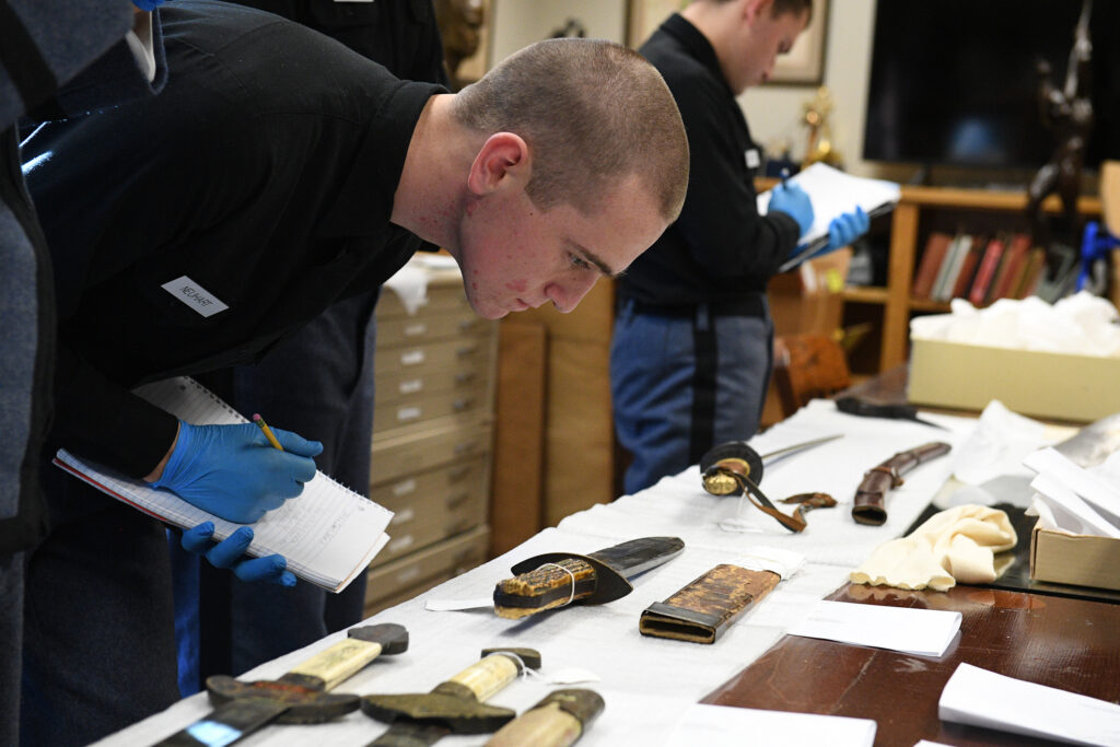 Cadets in Lt. Col. Kevin Braun’s general chemistry lab took their research to an unlikely place — the VMI Museum on post. The archeology-themed activity called for the cadets to choose unidentified displayed artifacts, and use their prior knowledge of metals to speculate their origin.