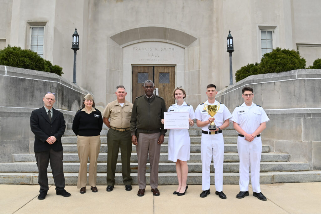 Cadets and faculty pose with award.