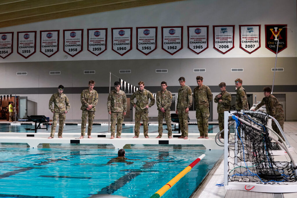 Cadets line up to swim in the swimming pool.