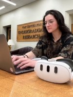 Cadet Nathalie Lavender ’26 works at a computer in the VCUR office space.
