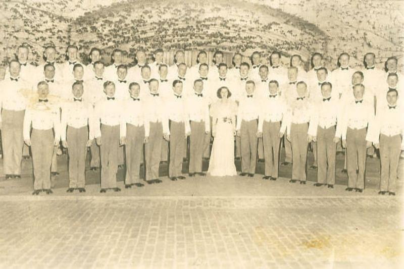 The first organized VMI Glee Club with Director Mrs. Marguerite Ramey.  Mrs. Ramey, the wife of faculty member M. G. Ramey, ser. VMI Archives.