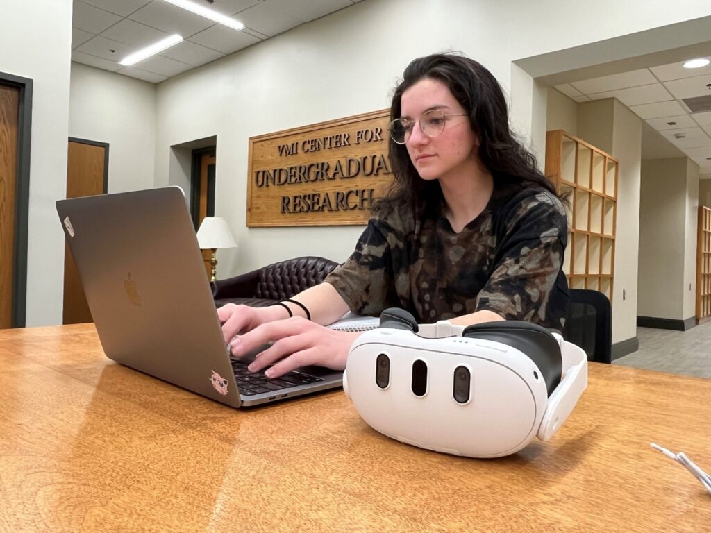 Lavender ’26 works at a computer in the VCUR office space.