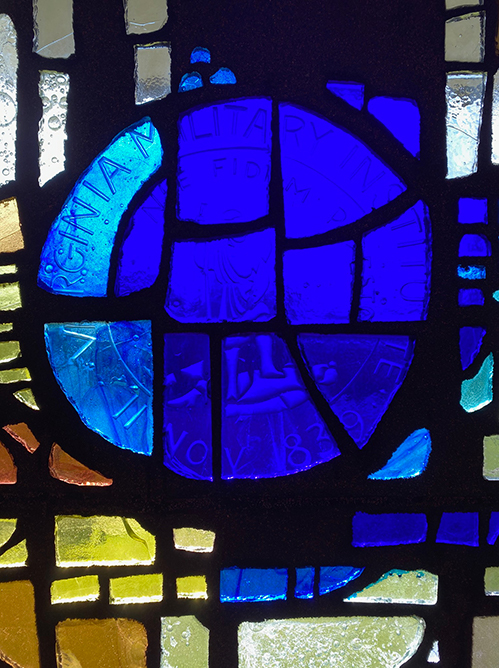 Close-up of VMI Seal on Stained Glass Mural Wall