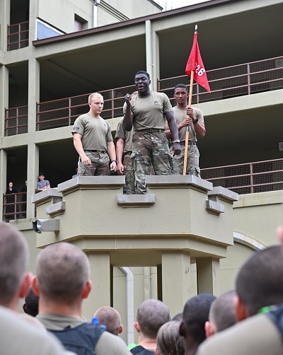 Cadets stand on the parapet inside barracks.