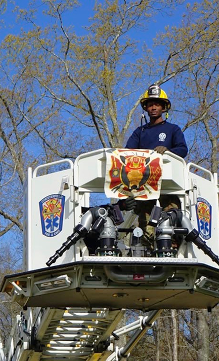 VMI cadet in a fire truck bucket