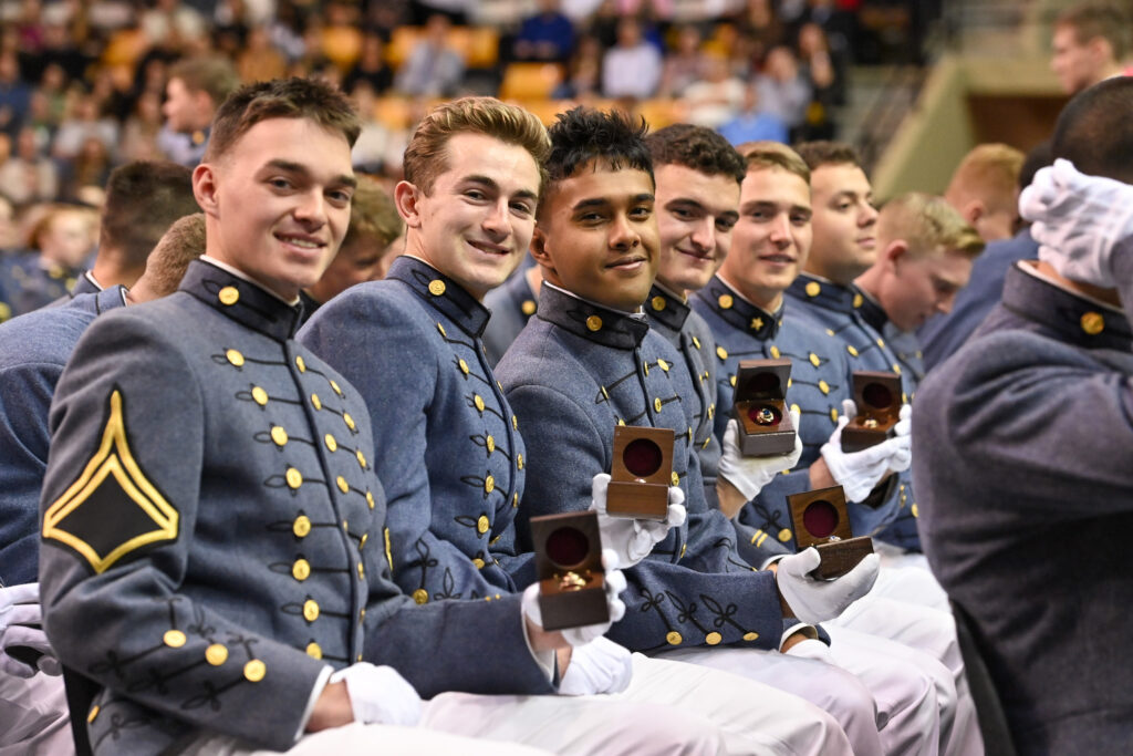 Cadets show off their rings during the Ring Figure ceremony.