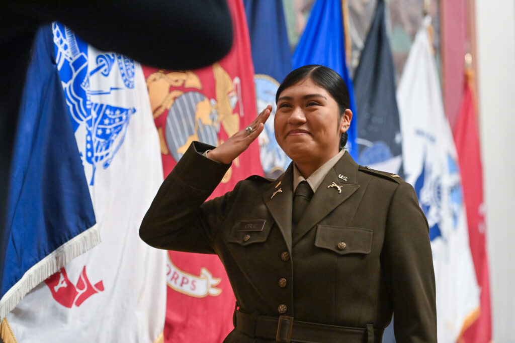 A new 2nd Lieutenant salutes during her Army ROTC Commissioning event at VMI.