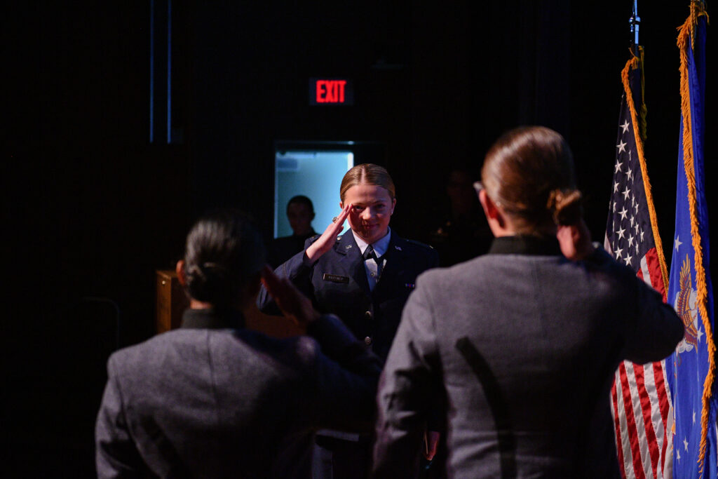 A newly commissioned Second Lieutenant salutes her classmates during the Air Force ROTC pin-on ceremony at VMI.