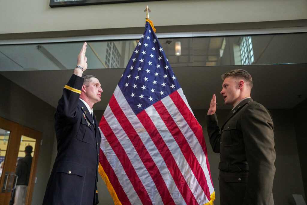 A commissioned cadet takes the oath of his branch.