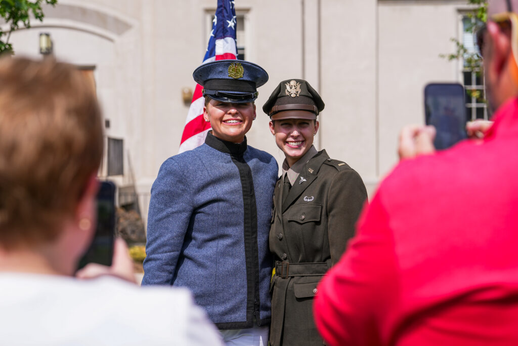 A newly commissioned Army officer poses for a photo with her classmate.