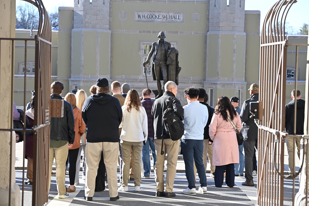 A cadet guide leads a tour on post.