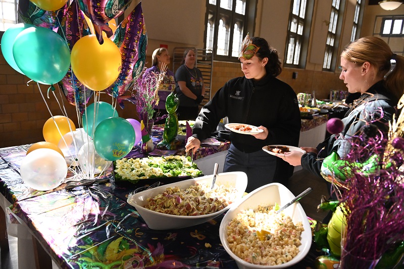 Cadets enjoy a selection of holiday foods in Crozet Hall during Mardi Gras.