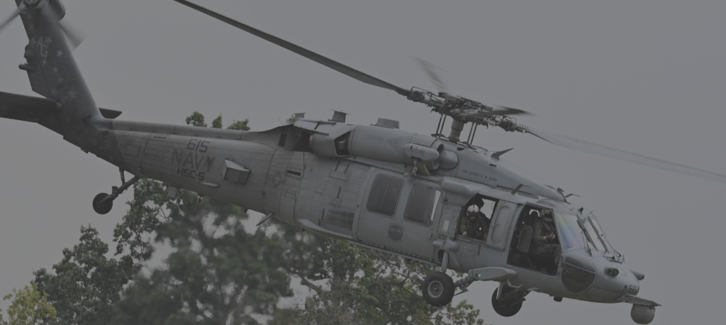 Cadets flying in a helicopter as part of training for Navy ROTC.