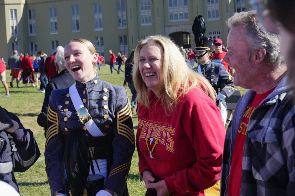 Cadets pose with their family members during family weekend.