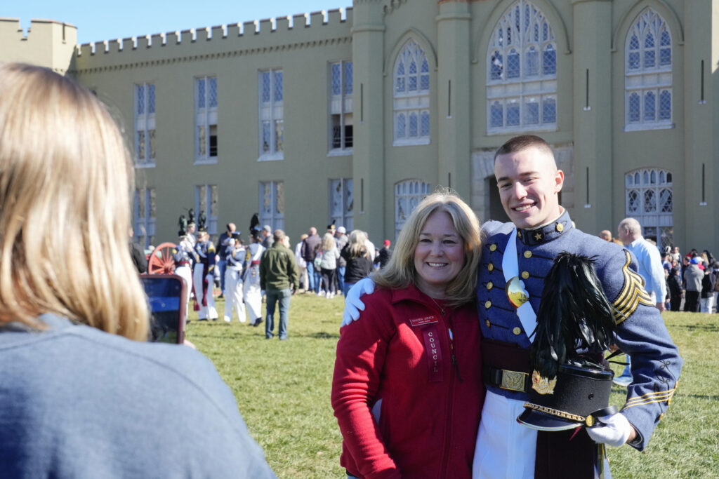 Cadets pose with their family members during family weekend.