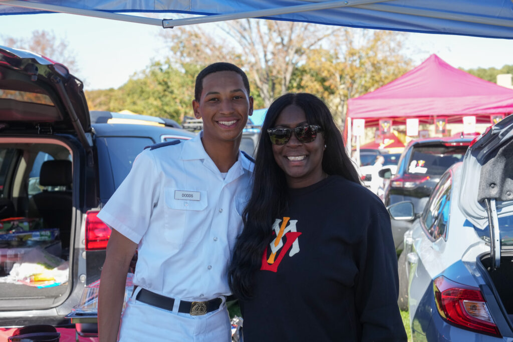 Cadets pose with their family members during family weekend.